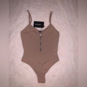 PrettyLittleThing beige zip up ribbed bodysuit